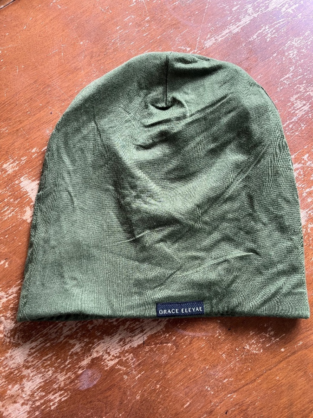 Grace Eleyae The Slap Satin lined cap in olive green sleep bonnet